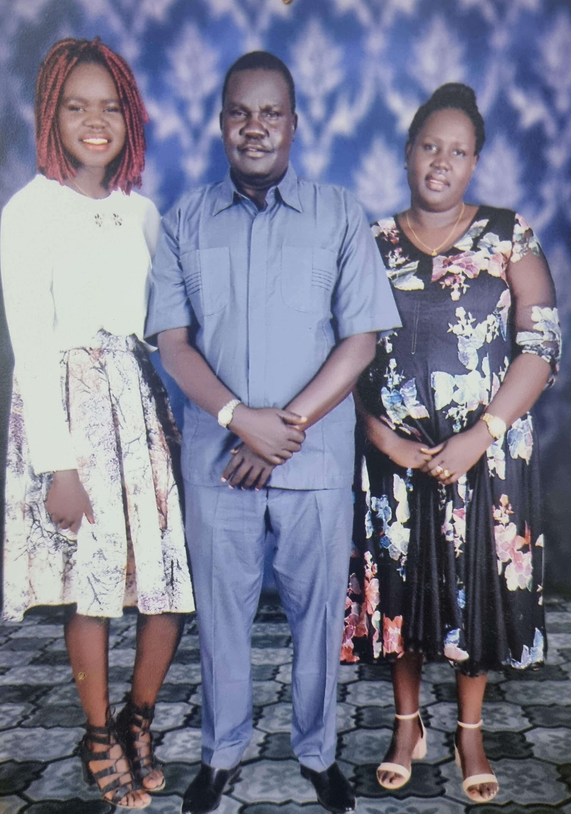 Nyakuoy with her father and mother.