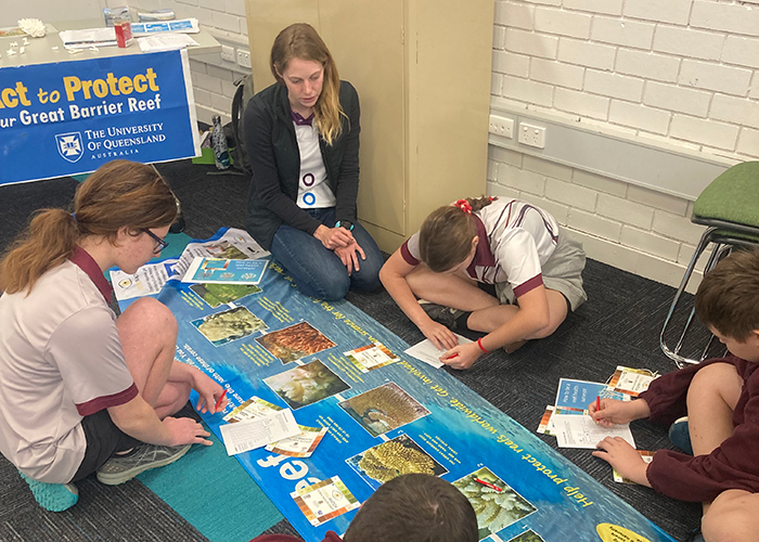 Abigail teaching students as part of the Flying Scientists program.