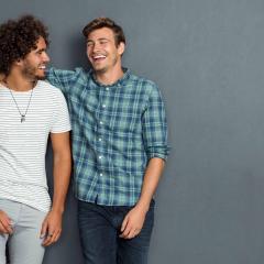 Two male friends laughing
