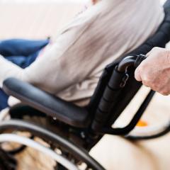 Woman in a wheelchair.