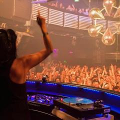 Rebecca Poulsen DJ-ing at a nightclub